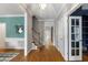 Bright foyer featuring hardwood floors, staircase, and elegant details at 3908 Sterling Ridge Ln, Durham, NC 27707