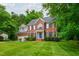 Attractive brick home with a well-maintained lawn and classic black shutters at 3908 Sterling Ridge Ln, Durham, NC 27707
