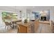 Open kitchen with granite countertops and seamless view to living area at 3908 Sterling Ridge Ln, Durham, NC 27707