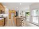 Spacious eat-in kitchen boasts a granite island, stainless appliances, and a breakfast nook with backyard views at 3908 Sterling Ridge Ln, Durham, NC 27707