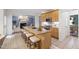 Bright eat-in kitchen features a granite island, tile backsplash, stainless appliances, and ample cabinet space at 3908 Sterling Ridge Ln, Durham, NC 27707