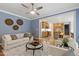Open-concept living room showcasing hardwood floors, neutral paint, and seamless access to the kitchen at 3908 Sterling Ridge Ln, Durham, NC 27707