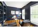 Stylish home office with custom built-in shelving and ample natural light at 3908 Sterling Ridge Ln, Durham, NC 27707