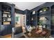 Home office featuring built-in shelving, a desk, and comfortable seating at 3908 Sterling Ridge Ln, Durham, NC 27707