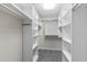 An expansive walk-in closet features adjustable shelving and ample storage space at 3908 Sterling Ridge Ln, Durham, NC 27707
