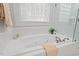 This bathroom features a large soaking tub and glass-walled shower at 3912 Kildrummy Dr, Durham, NC 27705