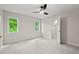 Bright bedroom with open walk-in closet and overhead ceiling fan at 3912 Kildrummy Dr, Durham, NC 27705