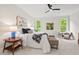 Bedroom featuring plush carpet, large windows, and modern decor at 3912 Kildrummy Dr, Durham, NC 27705