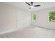 A sunlit bedroom features neutral walls, carpet and ceiling fan at 3912 Kildrummy Dr, Durham, NC 27705