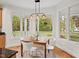 Bright eat-in kitchen with breakfast nook and large windows that overlook the backyard at 3912 Kildrummy Dr, Durham, NC 27705