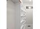 Bright closet boasts custom shelving and natural light from a nearby window at 3912 Kildrummy Dr, Durham, NC 27705