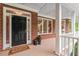 Inviting front porch and door of the home at 3912 Kildrummy Dr, Durham, NC 27705