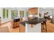 The eat-in kitchen offers granite countertops, stainless appliances, and lots of natural light at 3912 Kildrummy Dr, Durham, NC 27705