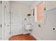 Cozy laundry room with sink and custom shelves and cabinets at 3912 Kildrummy Dr, Durham, NC 27705