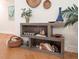 Living room shelving with books, pottery, and baskets adds a unique decorative touch at 3912 Kildrummy Dr, Durham, NC 27705