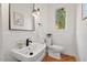 Elegant powder room featuring stylish fixtures and finishes at 3912 Kildrummy Dr, Durham, NC 27705
