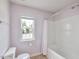 Bathroom featuring a tub and shower, toilet, and window with natural light at 407 Elm Farm Pl, Morrisville, NC 27560