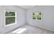This is a bright bedroom with a window offering outdoor views and natural light at 407 Elm Farm Pl, Morrisville, NC 27560