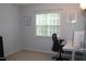 Comfortable bedroom with neutral walls, window and desk for a serene atmosphere at 407 Elm Farm Pl, Morrisville, NC 27560