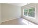 This bedroom has a window to bring in natural light and a view at 407 Elm Farm Pl, Morrisville, NC 27560