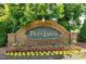 Brick community sign with 'Twin Lakes' displayed in gold lettering at 407 Elm Farm Pl, Morrisville, NC 27560