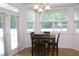 Bright dining area with a door leading to a patio, perfect for entertaining at 407 Elm Farm Pl, Morrisville, NC 27560