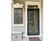 Stylish front door with a glass panel and decorative trim at 407 Elm Farm Pl, Morrisville, NC 27560