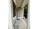 Inviting porch with stylish seating and decorative trim, leading to the front door at 407 Elm Farm Pl, Morrisville, NC 27560