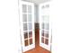 Office with hardwood floors viewed through French doors at 407 Elm Farm Pl, Morrisville, NC 27560