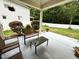 Covered patio area with seating, perfect for enjoying the outdoors at 407 Elm Farm Pl, Morrisville, NC 27560