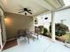 Relaxing covered patio featuring a ceiling fan and outdoor furniture at 407 Elm Farm Pl, Morrisville, NC 27560