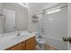 Bathroom features a tub/shower combo and a single sink vanity at 408 Flagg Rd, Holly Springs, NC 27540