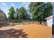 Large wooden deck in the backyard features railings for safety at 408 Flagg Rd, Holly Springs, NC 27540