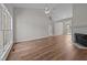 Bright living room with large windows, fireplace, and hardwood floors at 408 Flagg Rd, Holly Springs, NC 27540