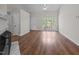 Bright living room with large windows, fireplace, and hardwood floors at 408 Flagg Rd, Holly Springs, NC 27540