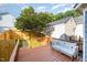 Inviting back deck with seating area, landscaping, and privacy fence, ideal for outdoor relaxation at 408 Heritage Village Ln, Apex, NC 27502