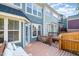 Spacious back deck, offering an outdoor seating area with a wooden fence and view of the home's rear at 408 Heritage Village Ln, Apex, NC 27502