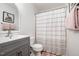 Cozy bathroom featuring a vanity, toilet, and tub-shower combination with stylish decor at 408 Heritage Village Ln, Apex, NC 27502