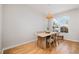 Cozy dining area features a rustic wooden table, comfortable seating, and natural light at 408 Heritage Village Ln, Apex, NC 27502