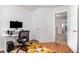 A second view of the bright office with the door open to another room at 408 Heritage Village Ln, Apex, NC 27502