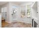 Bright sunroom with tiled floors, plenty of natural light and built-in shelves for ample storage at 408 Heritage Village Ln, Apex, NC 27502