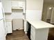 Clean kitchen featuring white subway tile backsplash and new countertops at 411 Gooseneck Dr # A1, Cary, NC 27513