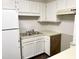 This kitchen features a stainless steel double sink and matching white cabinetry at 411 Gooseneck Dr # A1, Cary, NC 27513