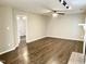 Spacious living room boasts wood floors and a traditional fireplace at 411 Gooseneck Dr # A1, Cary, NC 27513
