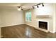 Bright living room featuring modern flooring and a cozy fireplace at 411 Gooseneck Dr # A1, Cary, NC 27513