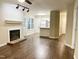 Inviting living room with cozy fireplace and modern flooring at 411 Gooseneck Dr # A1, Cary, NC 27513