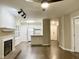 Spacious living room featuring fireplace and seamless kitchen access at 411 Gooseneck Dr # A1, Cary, NC 27513