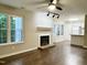Inviting living room with cozy fireplace and new floors at 411 Gooseneck Dr # A1, Cary, NC 27513