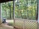 This view from the covered patio shows a wooded backyard at 411 Gooseneck Dr # A1, Cary, NC 27513