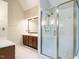 Bathroom featuring a glass enclosed walk-in shower, dual sinks, and vanity at 4204 Thetford Rd, Durham, NC 27707